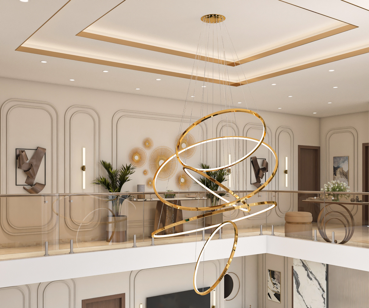 Double-height lobby with layered gold ring chandelier and classical wall panelling