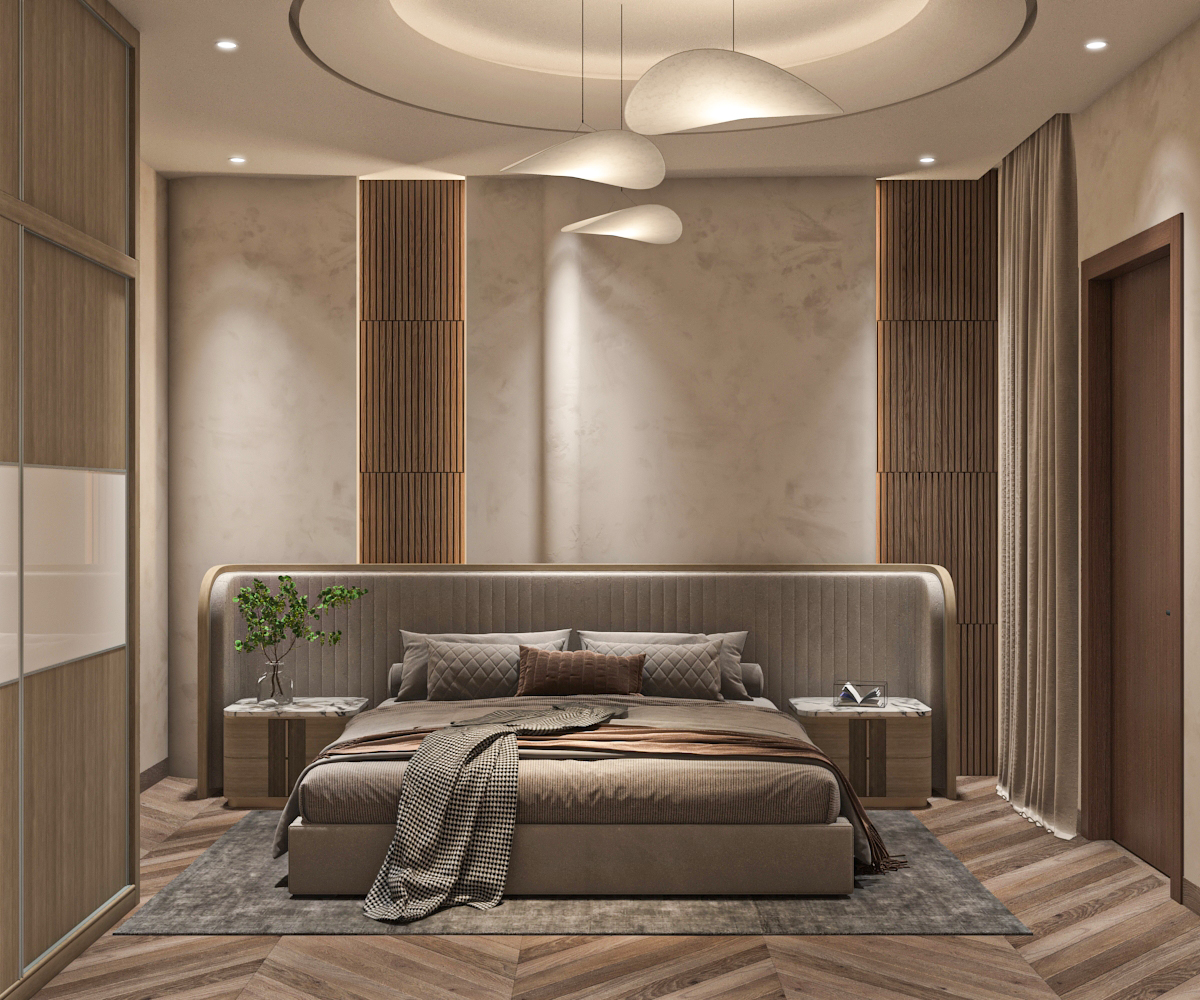 Guest bedroom with curved upholstered headboard, sculptural pendants, and herringbone flooring